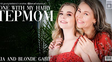 Mature.nl Alexia (48) & Blonde Gabie (EU) (24) - Hot young Blonde Gabie licking her stepmom Alexia's wet hairy pussy on the couch - 1 July 2023
