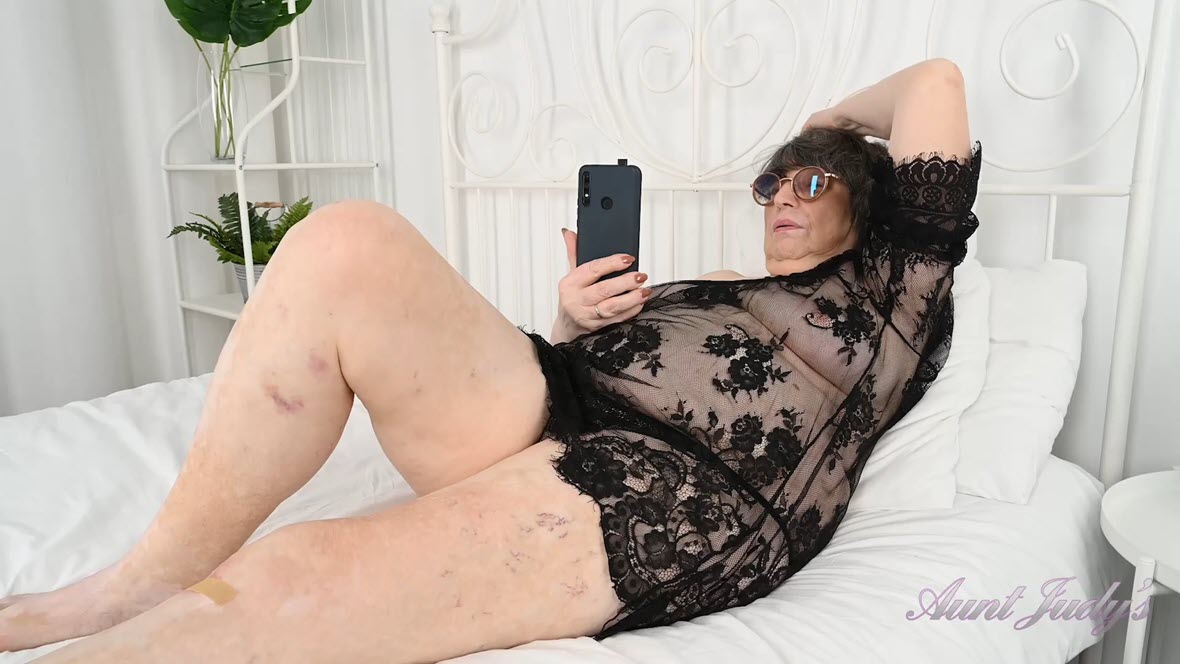 AuntJudys Sharon Masturbates in Bed in Lacy Black Lingerie